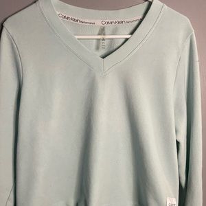 Calvin Klein blue top.